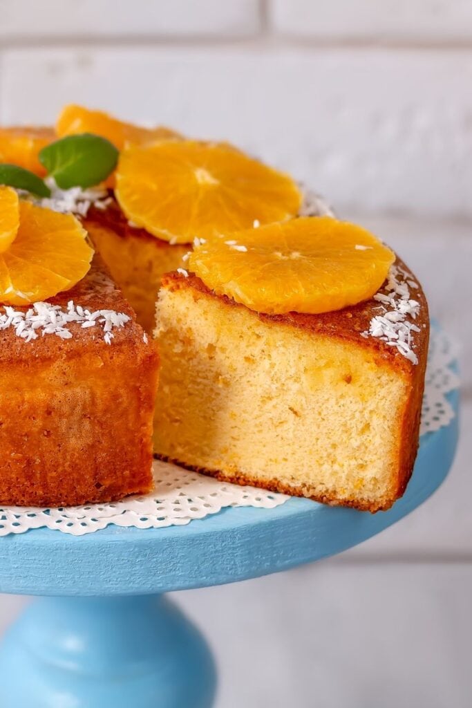Homemade Orange Cake with Shredded Coconut and Fresh Orange