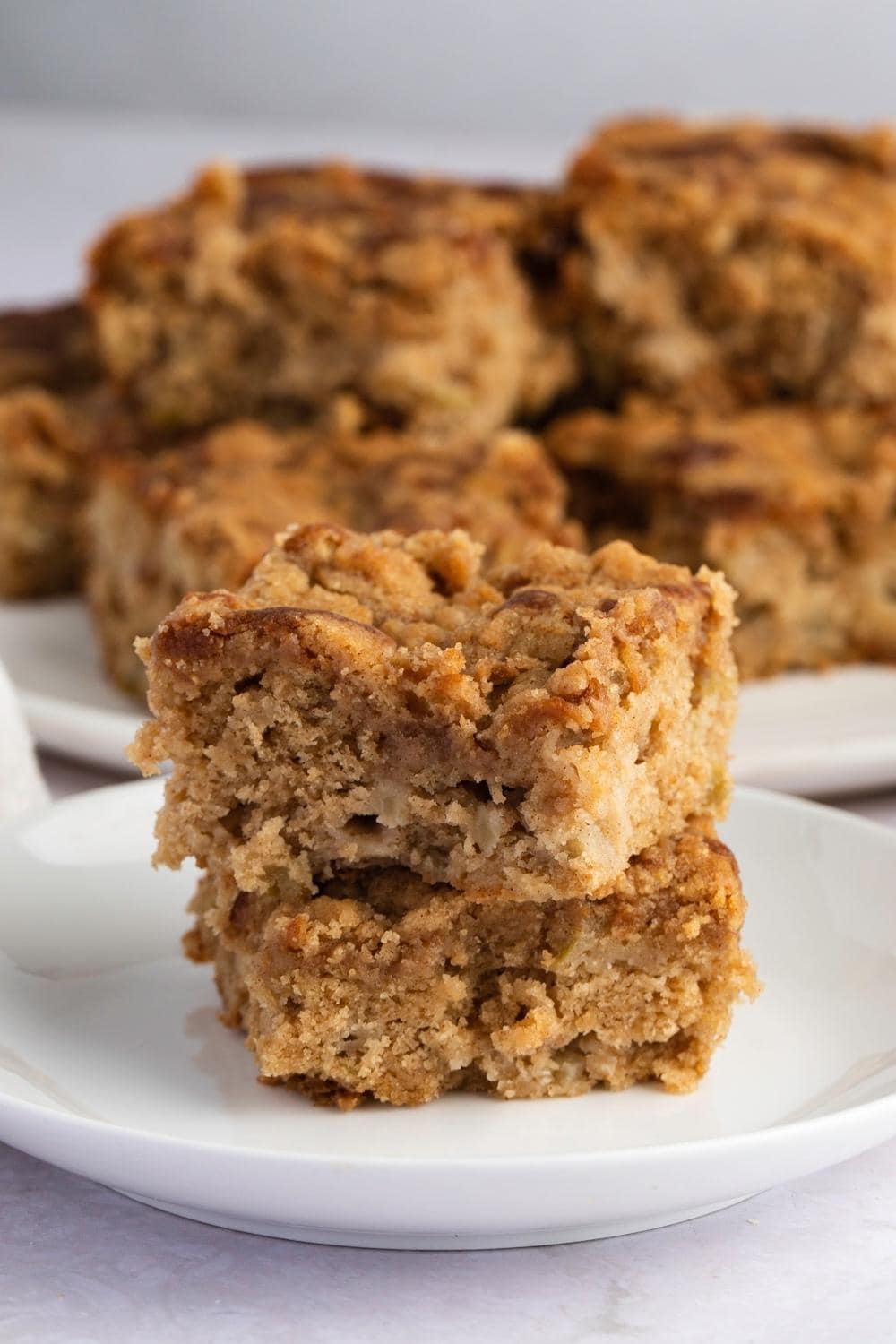 Apple Coffee Cake slices on a white plate. 