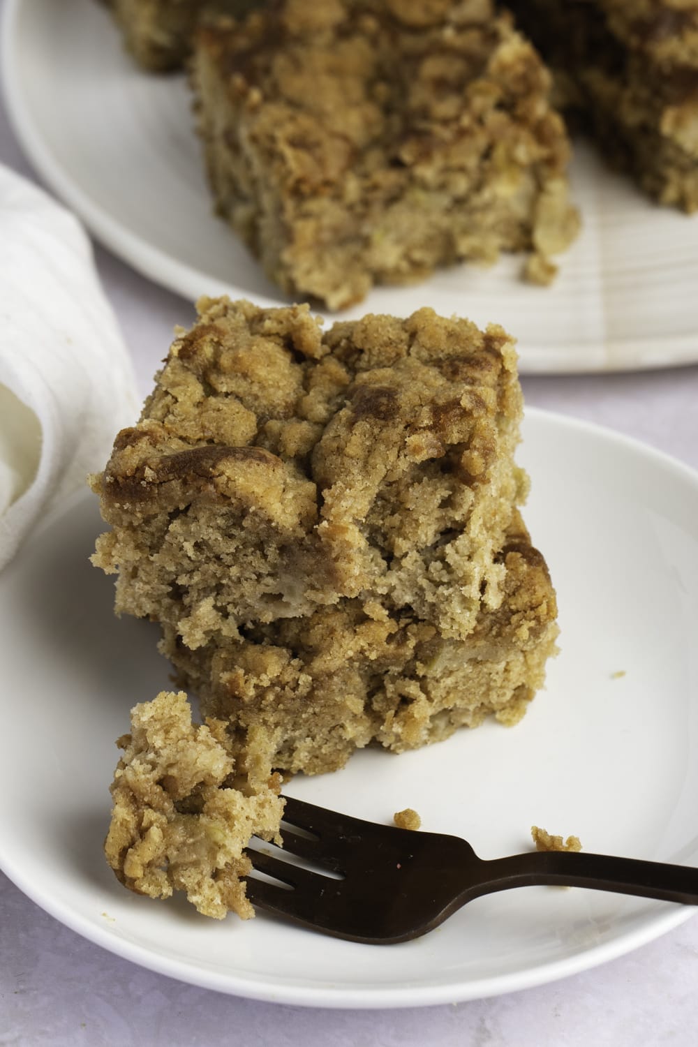 Slices of Apple Coffee Cake on a White Plate