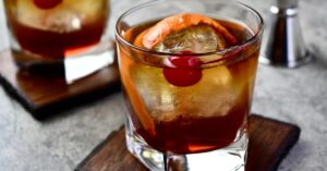 Boozy Dr. Pepper Bourbon Cocktail with Cherry and Orange