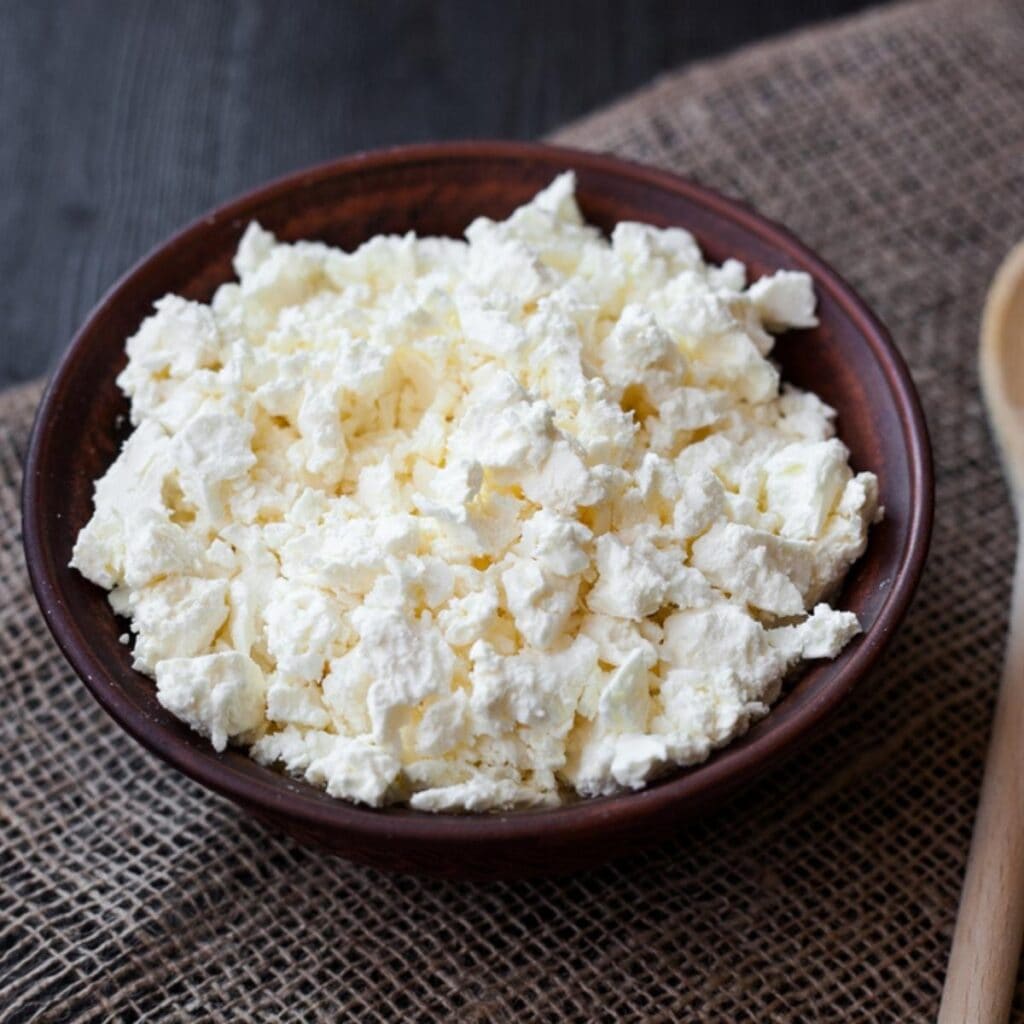 Cottage Cheese on a Wooden Dish