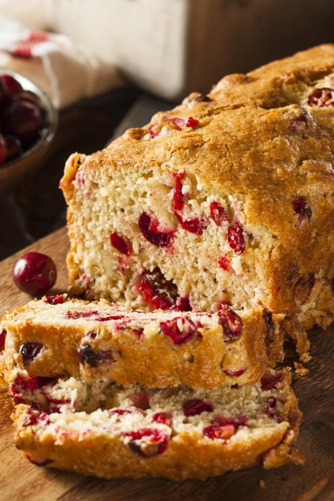 Homemade Cranberry-Orange Bread in a Chopping Board