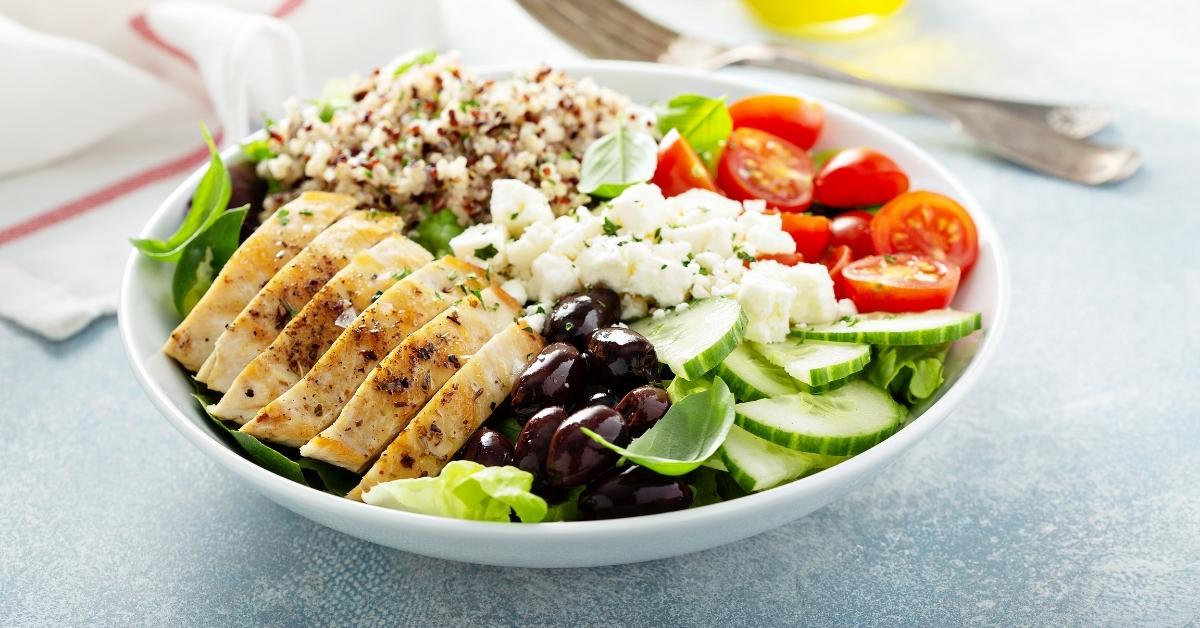 Homemade Greek-Style Lunch Bowl with Chicken, Black Beans, Cucumber, Feta, Quinoa and Tomatoes