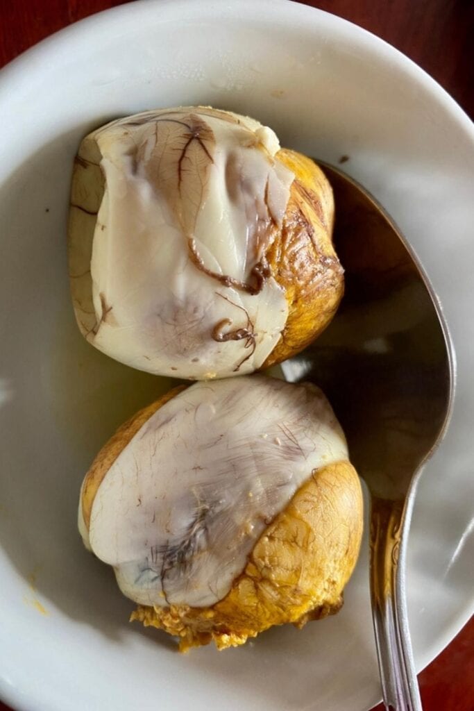 Two Pieces of Balut on a Plate