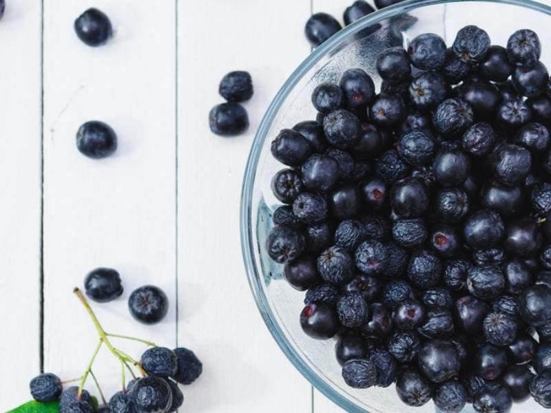 Chokeberries on a Glass Bowl