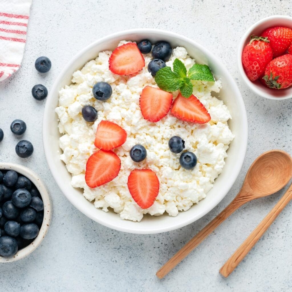 Cottage Cheese with Strawberries and Blueberries in a Bowl