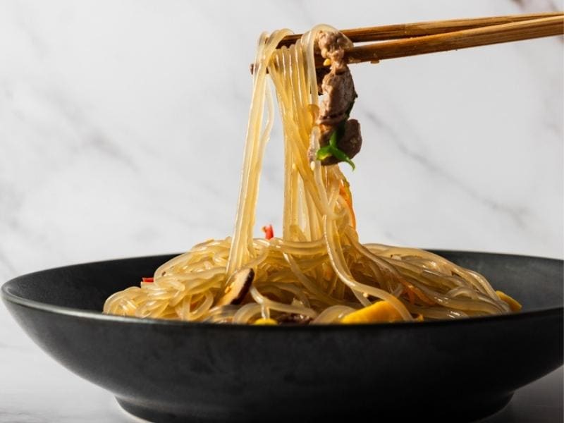 Cooked Glass Noodles Flavored with Pork Bits and Vegetables