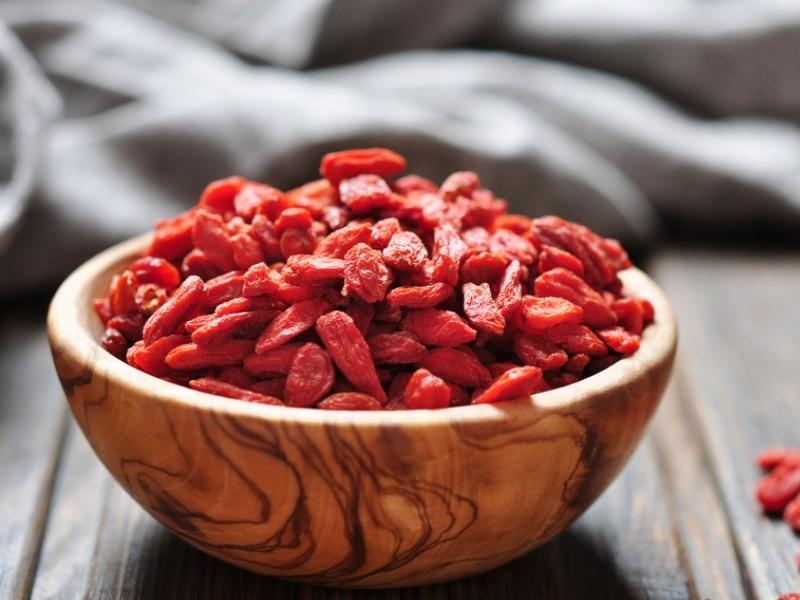 Goji Berries on a Wooden Bowl