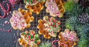 Homemade Christmas Waffles with Peppermint Candies in a Baking Rack
