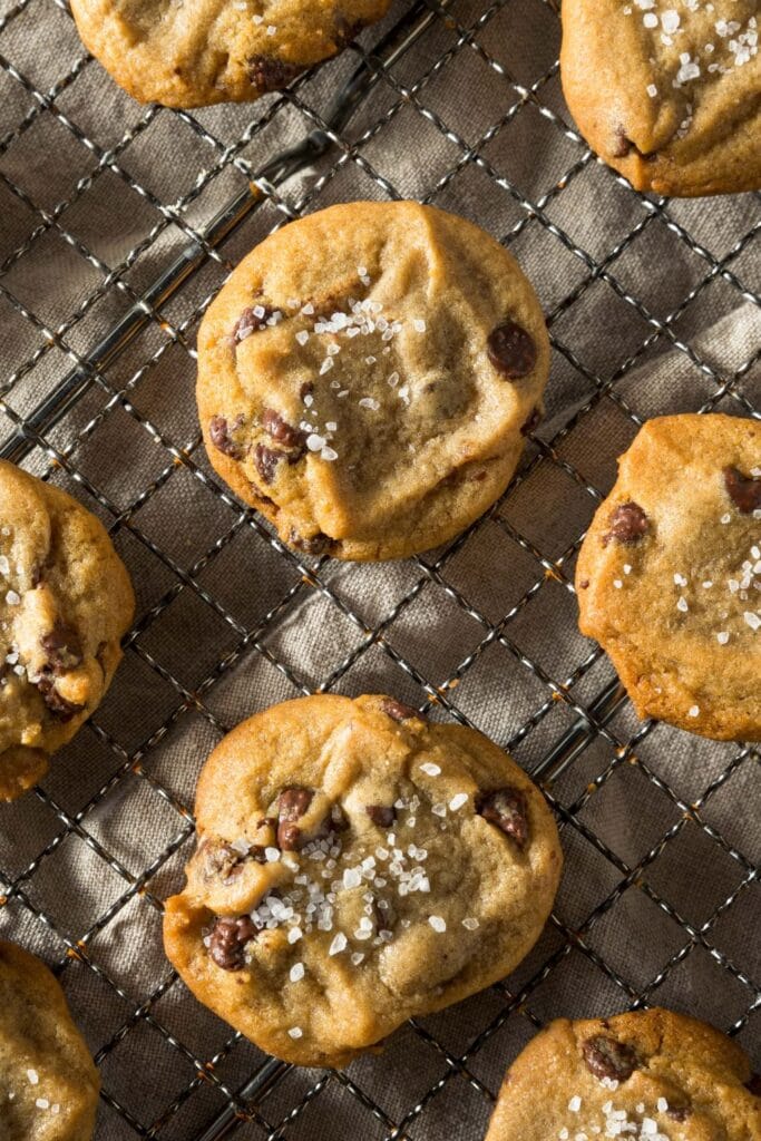 Homemade Salted Chocolate Chip and Tahini Cookies on a Baking Rack