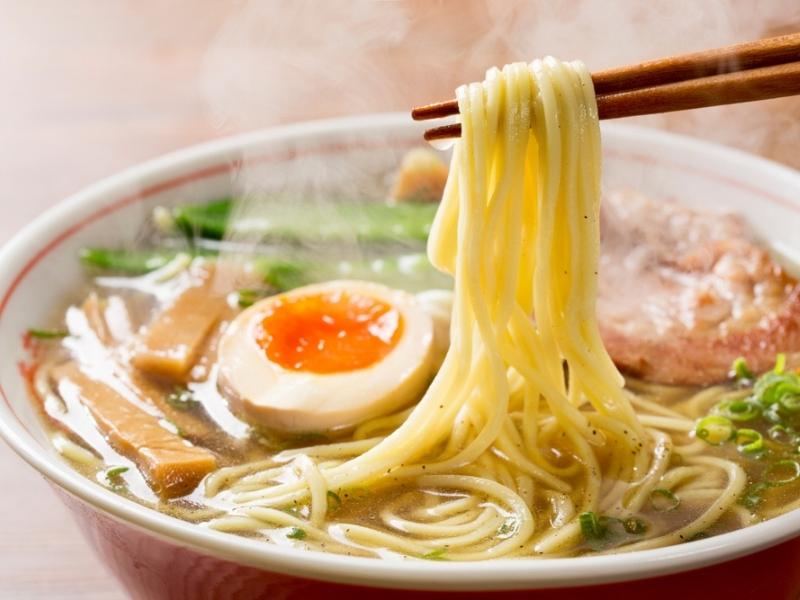 Flavorful Ramen Noodles on a Red Ceramic Bowls