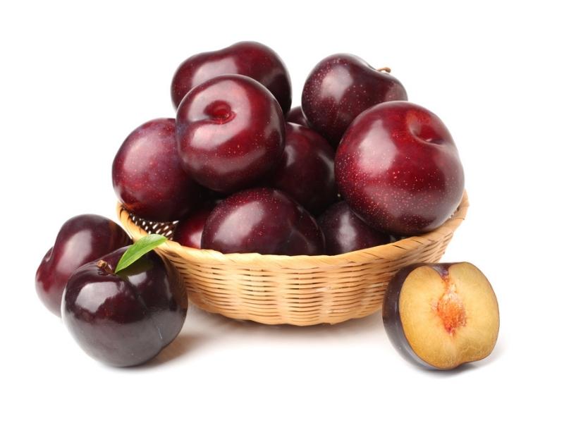 Santa Rosa Plums on a Small Wooden Basket