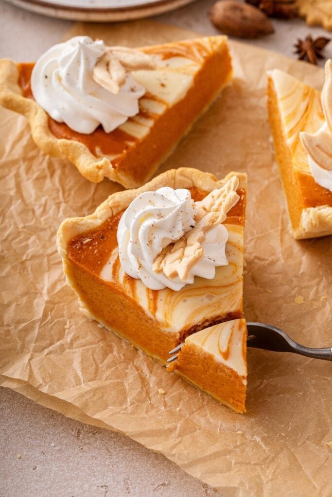 Slice of No-Bake Pumpkin Cheesecake with Whipped Cream