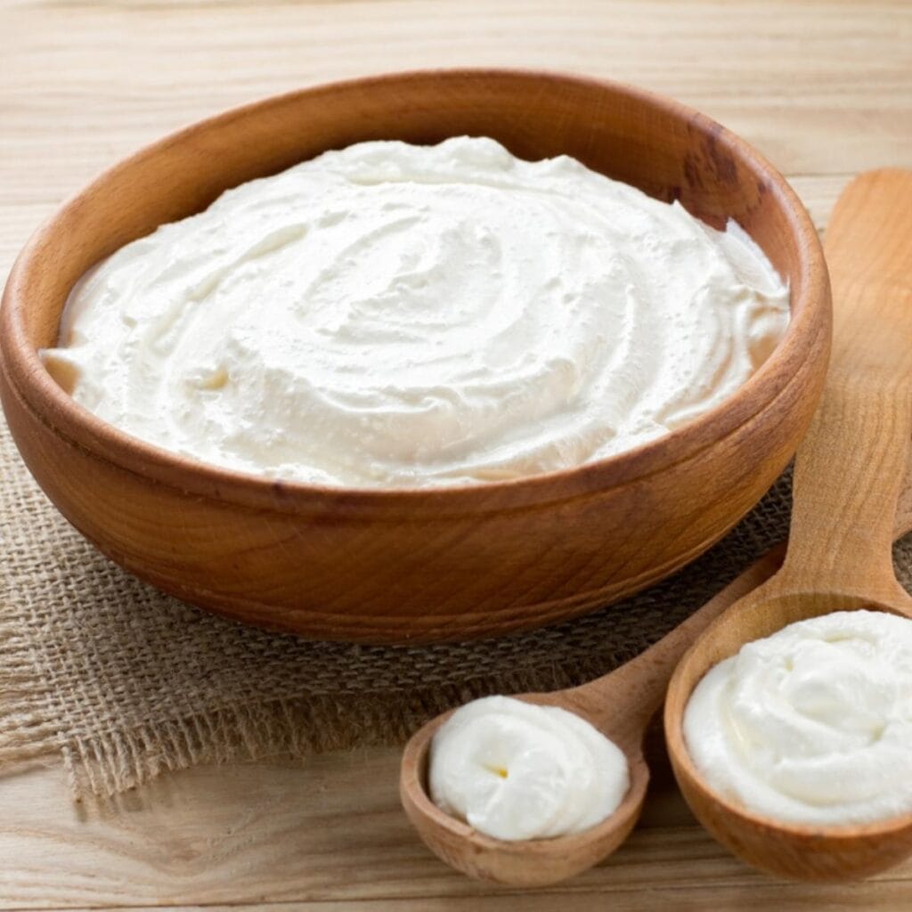Sour Cream on a Wooden Bowl