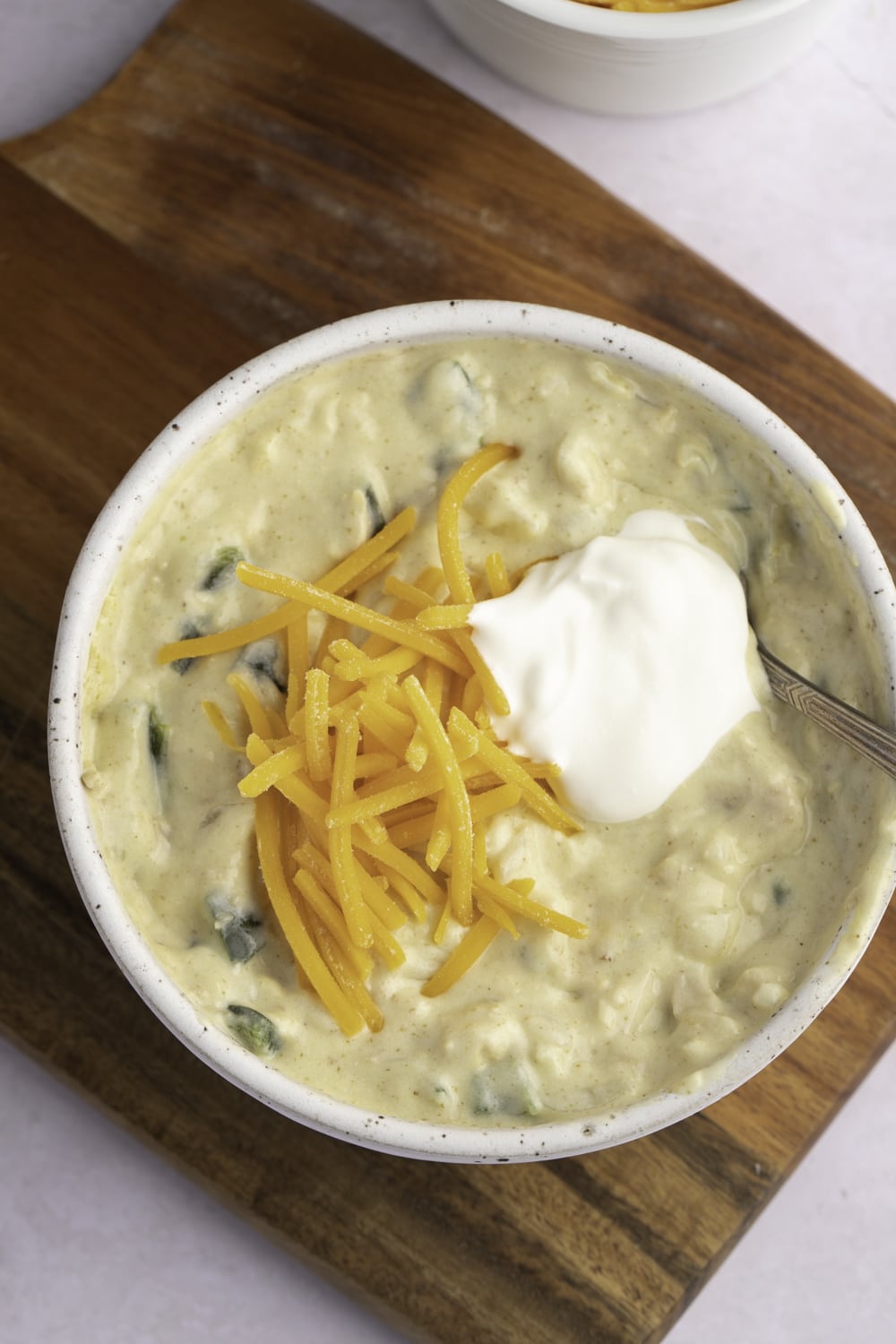 Green Chile Chicken Soup in a White Bowl