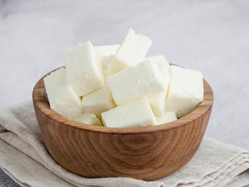 Paneer Cheese Cubes on a Wooden Bowl
