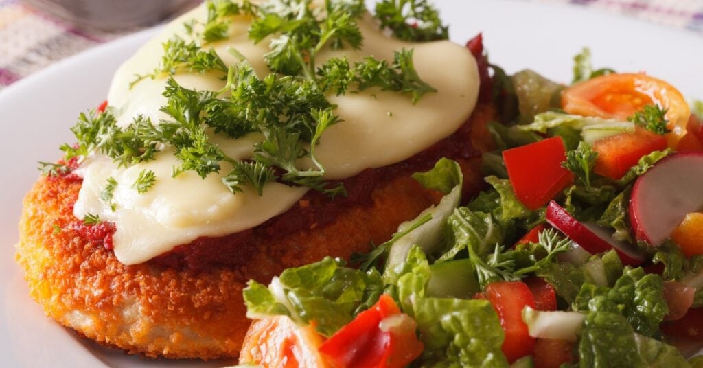 Chicken Parmesan Served With Vegetable Salad