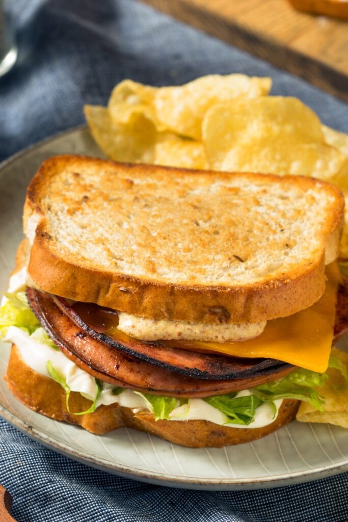 Fried Bologna Sandwich with Cheese, Lettuce and Chips