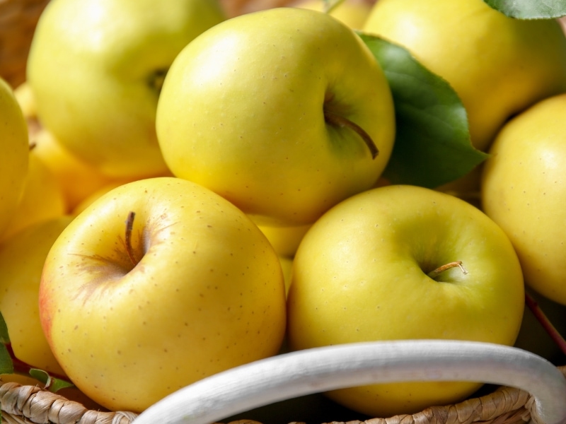 Golden Delicious Apple in a Brown Basket