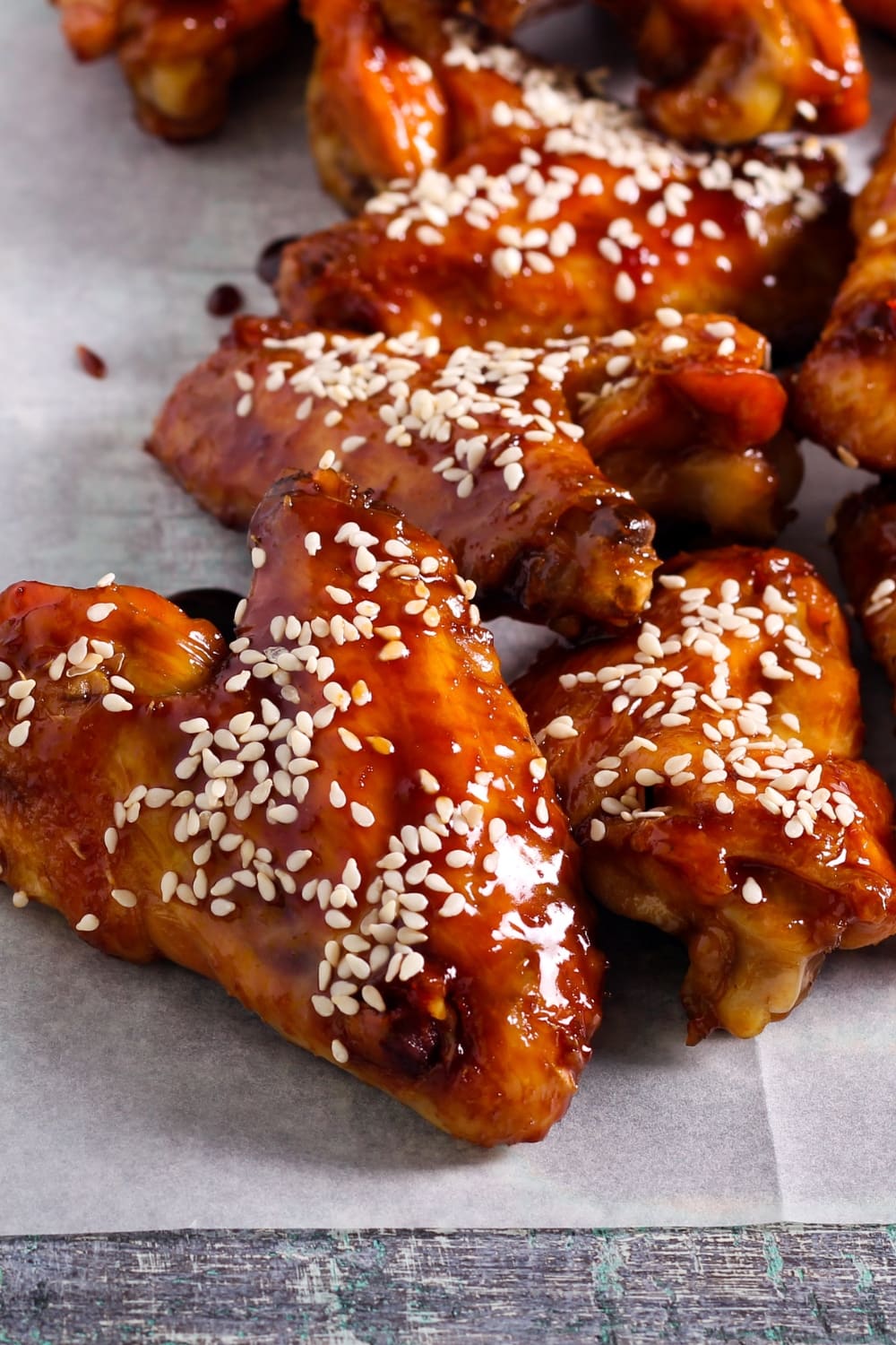 Glazed Honey Sriracha Chicken Wings Covered in Sesame Seeds