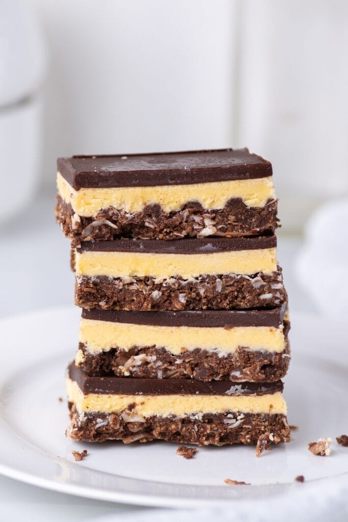Layered Nanaimo Bars Served on a White Plate
