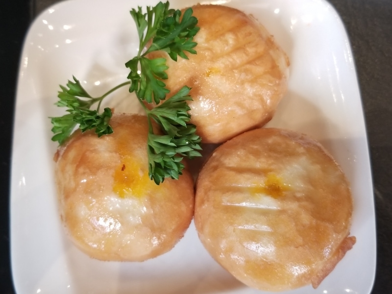 Nai Wong Bao (Custard Buns) on a White Plate