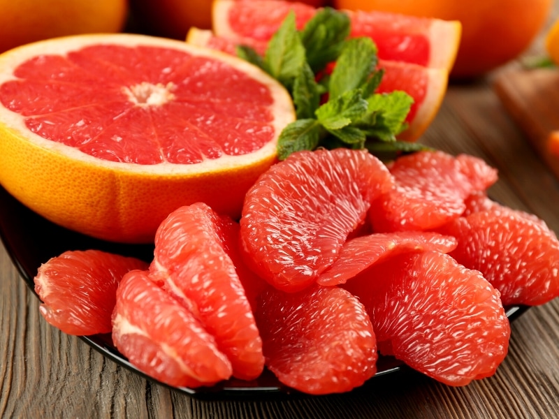 Pink Grapefruit Peeled on a  Ceramic Plate