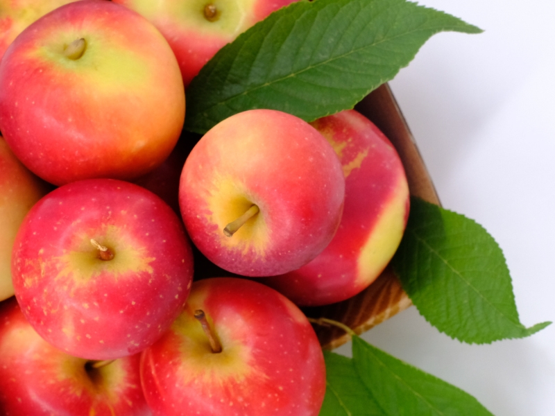 Pink Lady Apple on a Brown Bowl