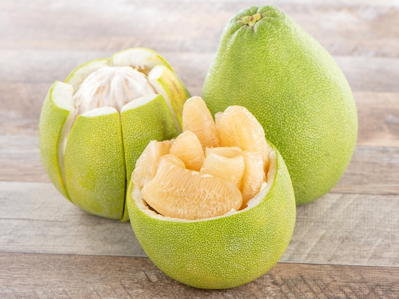 Pomelo Grapefruit on Top of a Wooden Table 