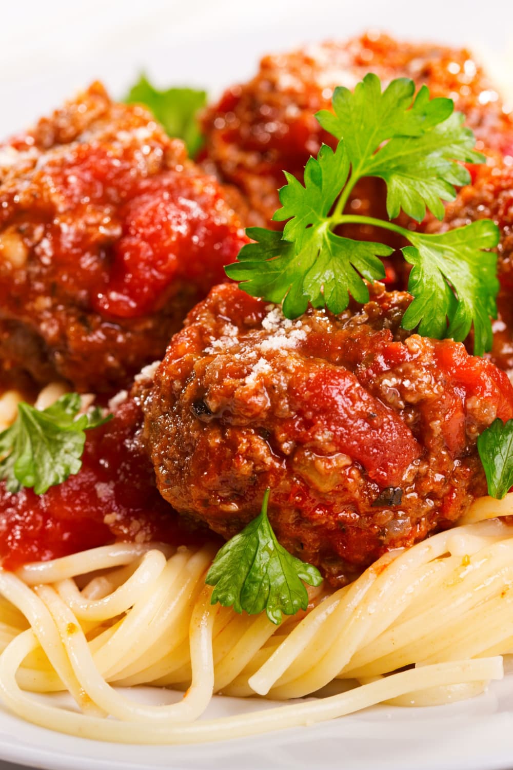 Rachael Ray Meatballs topped on spaghetti pasta. 