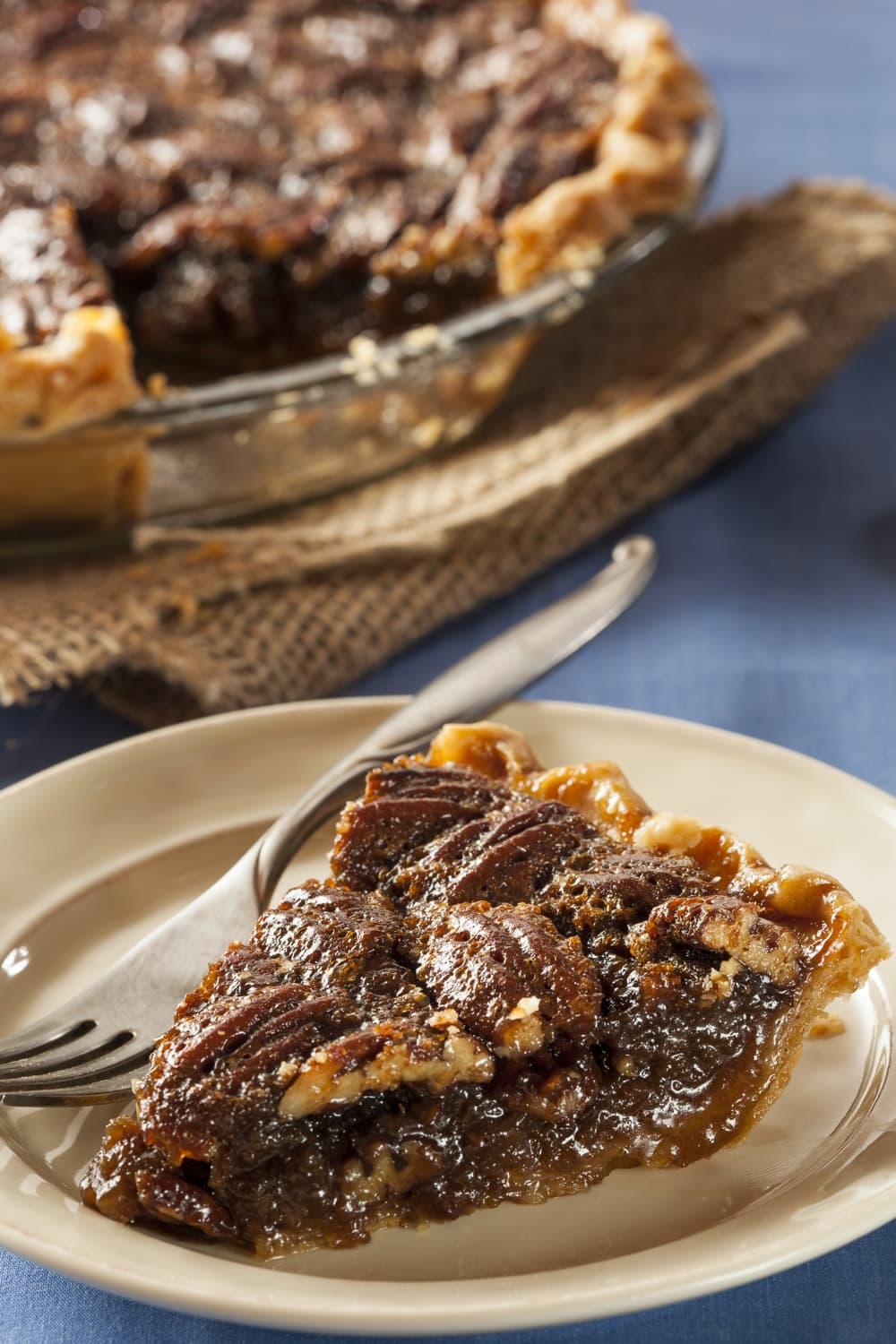 A slice of pecan pie on a plate 