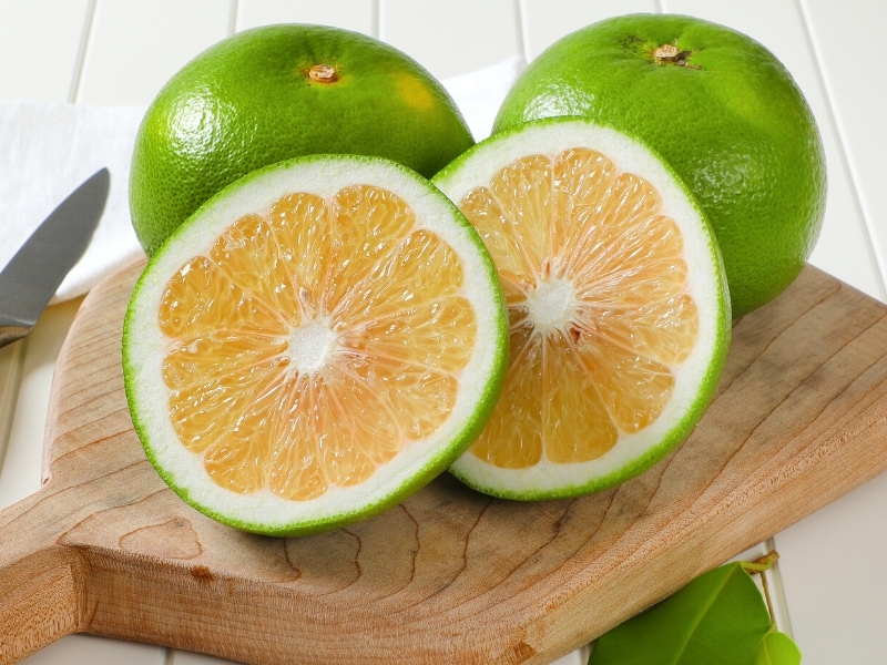 Sweeties Grapefruit on a Cutting Board 