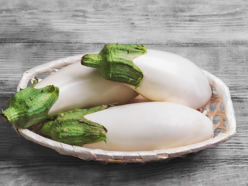 White Eggplants on a Wicker Basket