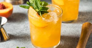 Boozy Refreshing Peach Bourbon Smash with Cold Ice