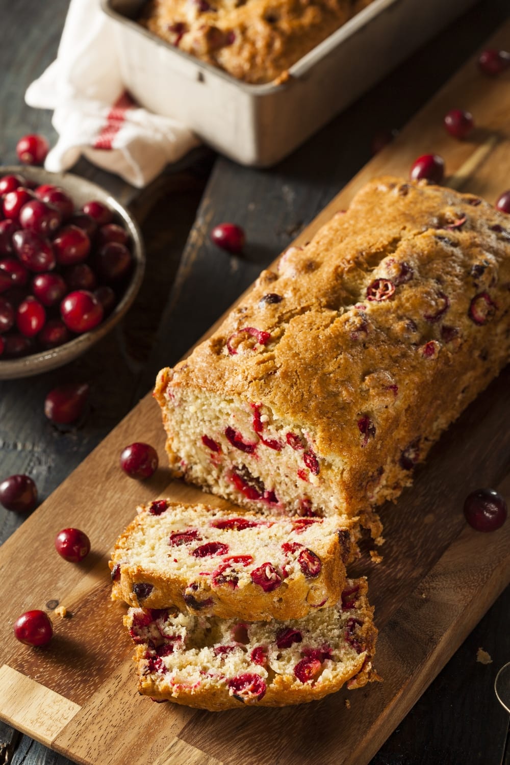 Homemade Cranberry Orange Bread in a Wooden Board