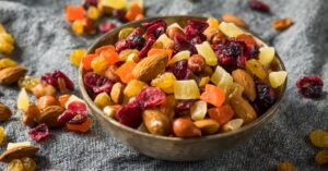 Bowl of Healthy Dried Fruits and Nut Mix with Almonds, Raisins and Cranberries