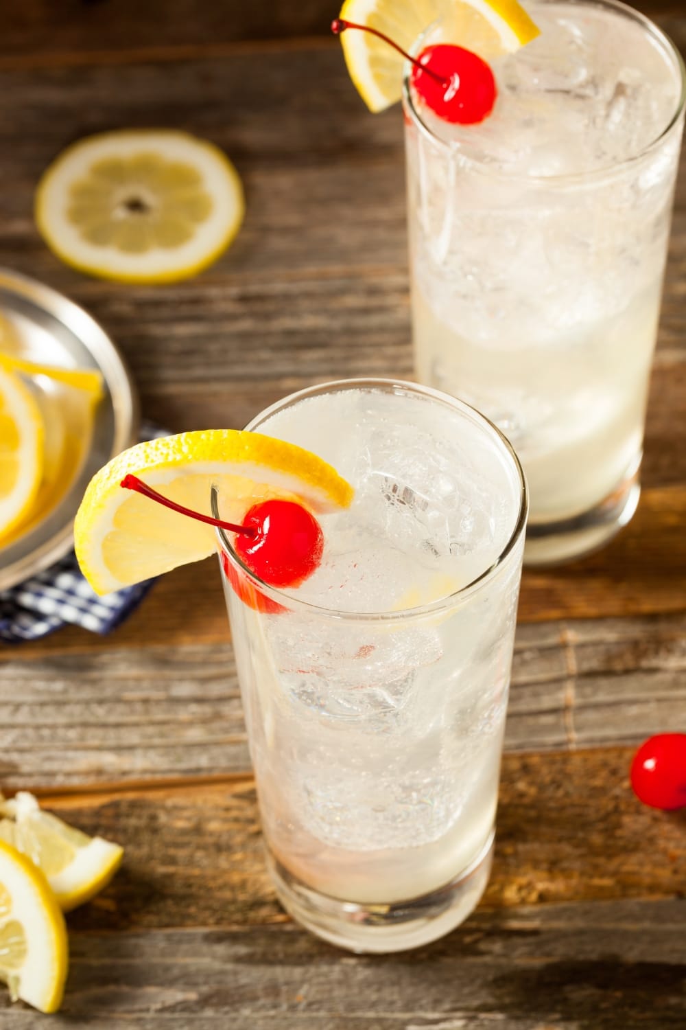 Classic Tom Collins Cocktail with Cherry and Lemon Slice