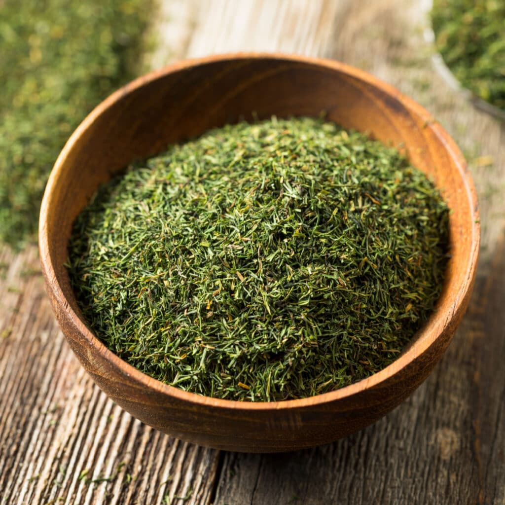 Dill Leaves on a Wooden Bowl