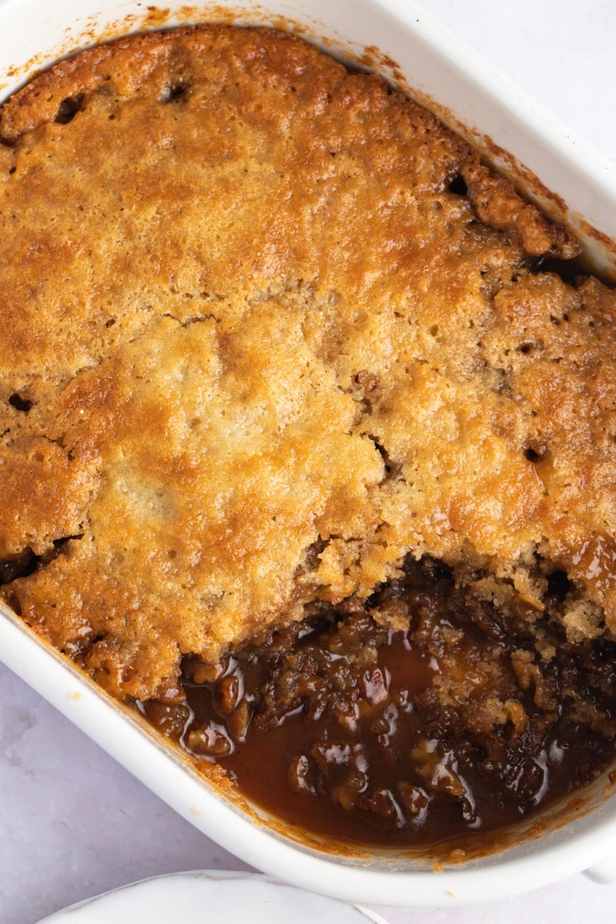 Homemade Pecan Pie Cobbler in A White Casserole Dish