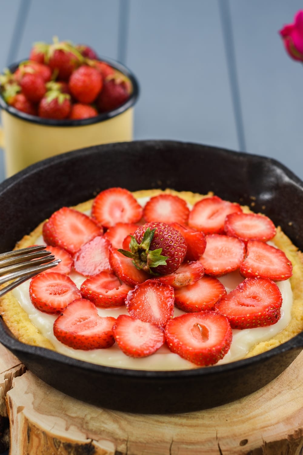 Homemade Strawberry Cake in a Skillet, Topped With Sliced Berries and Cream