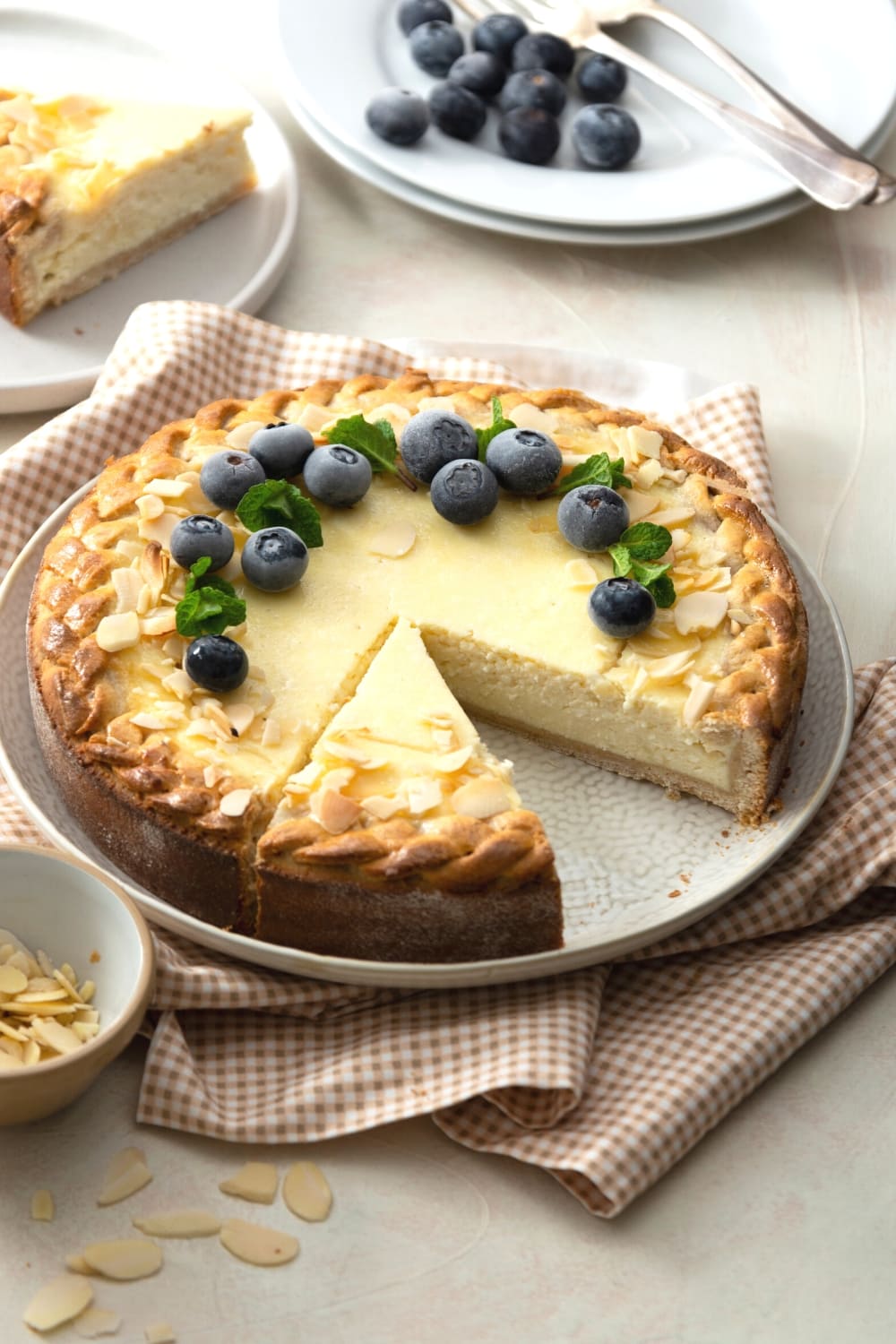 Sliced Almond Cheesecake Topped With Fresh Berries and Sliced Almond Nuts