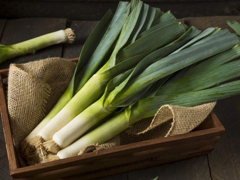 Leeks on a Wooden Box with Rustic Cloth