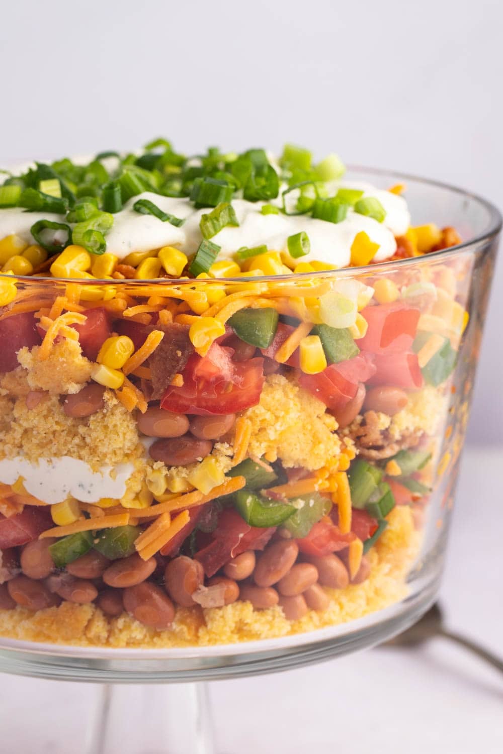 Cornbread Salad with Layers of Tomatoes, Cheese, Bacon and Green Onions