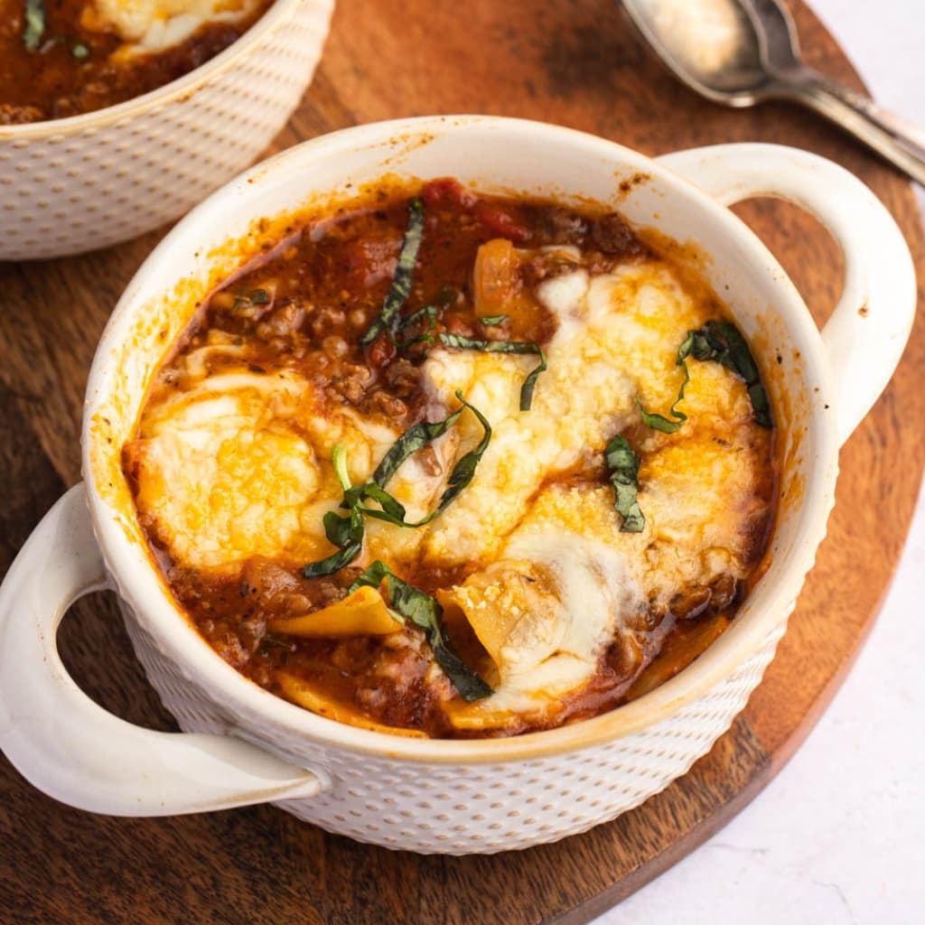 Crockpot Lasagna Soup With Melted Cheese and Chopped Parsley on Top