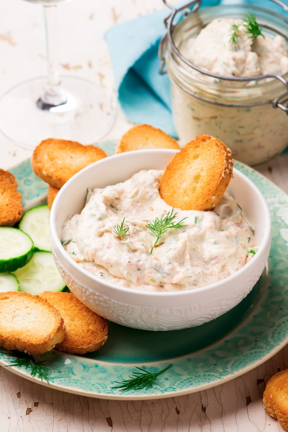 Biscuits and Cucumber Slices on a Plate served with a Bowl of Homemade Smoked Salmon Dip