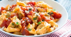 Homemade Tortellini with Herbs and Tomato Sauce