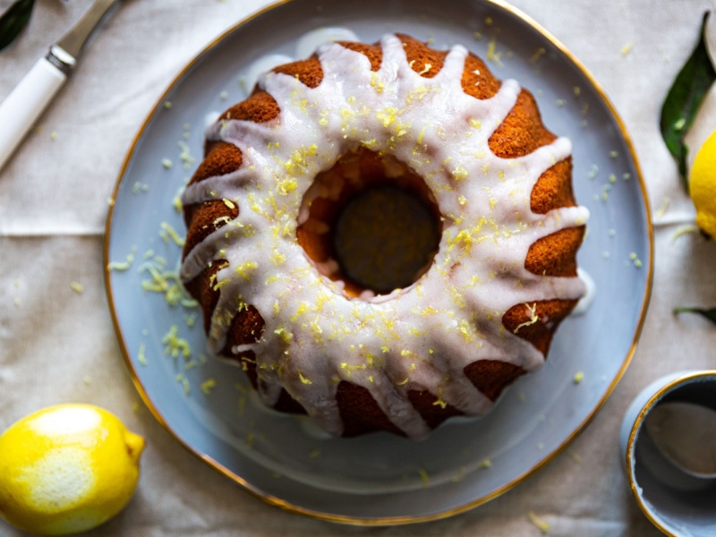 Over Head View of Lemon Sour Cream Cake Served on a Blue Porcelain Plate