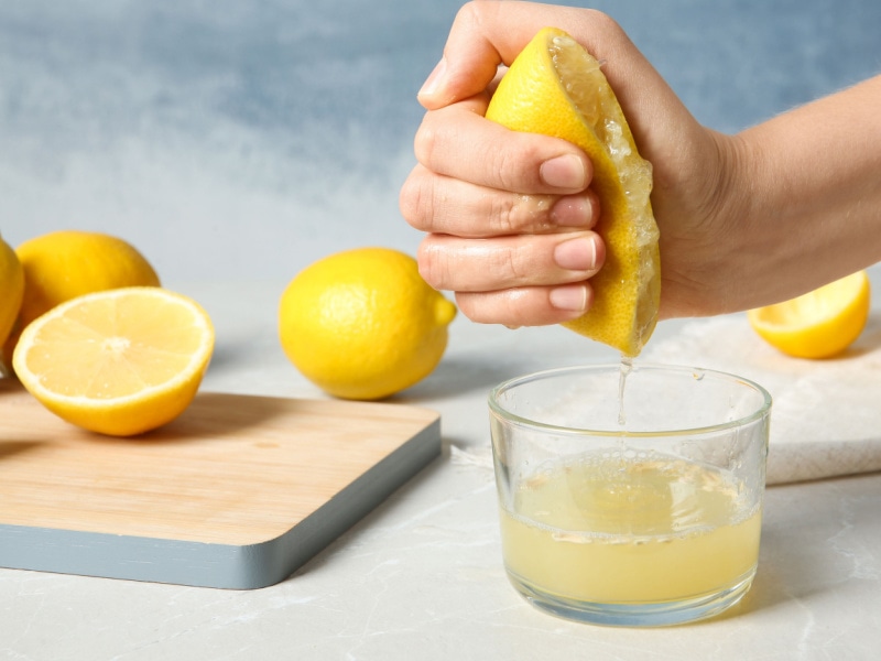 Ripe Lemons Manually Squeezed for Juice