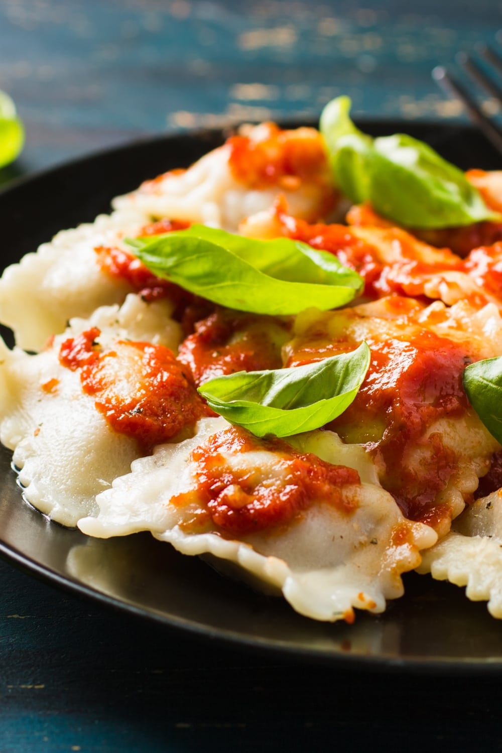 Ravioli with Tomato Sauce and Fresh Basil Leaves on Top