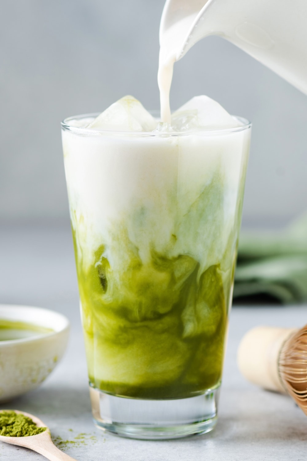 Soy Milk Pouring in an Iced Glass With Matcha 